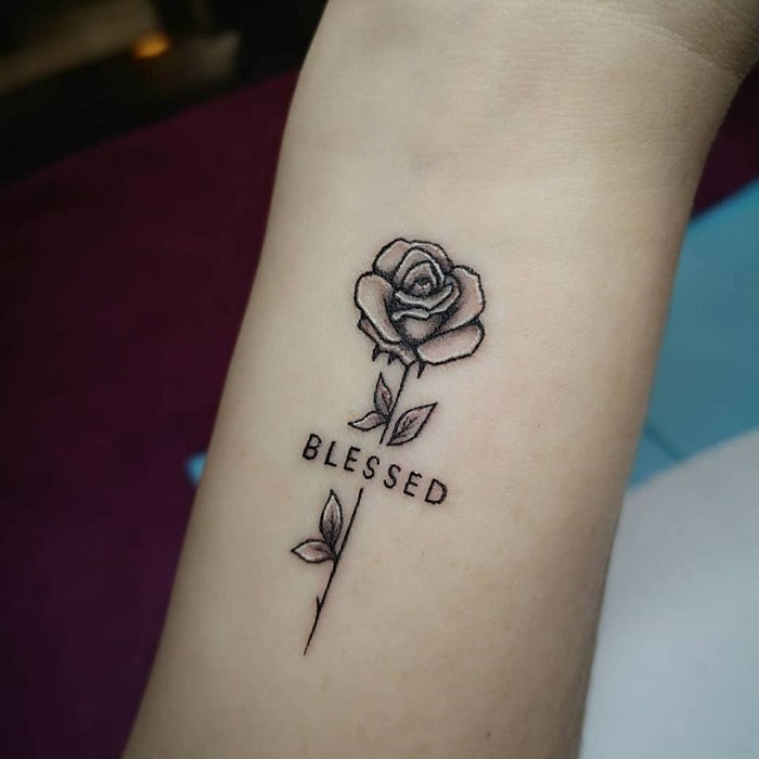 Healed microrealistic rose tattoo on the bicep