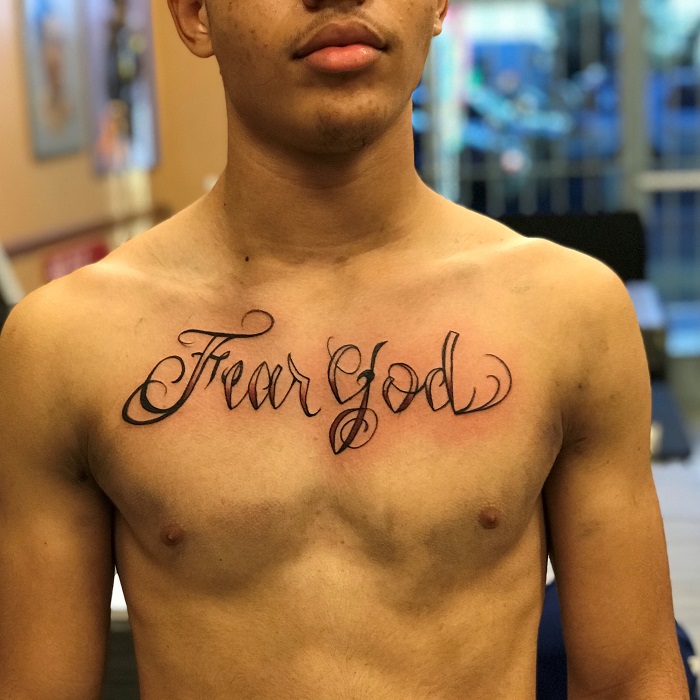 Dude getting red fear god tattoo on his chestTikTok Search