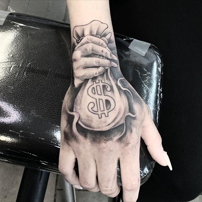 small money bag tattoo on handTikTok Search