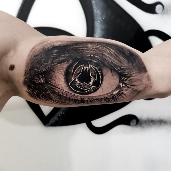 sharingan arm tattoo