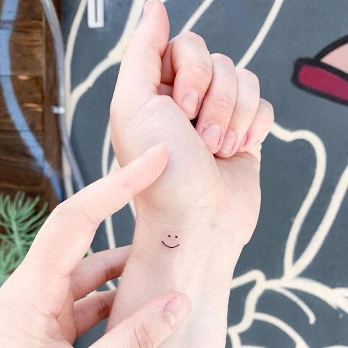 18 Cheerful Smiley Face Tattoo Designs  Moms Got the Stuff