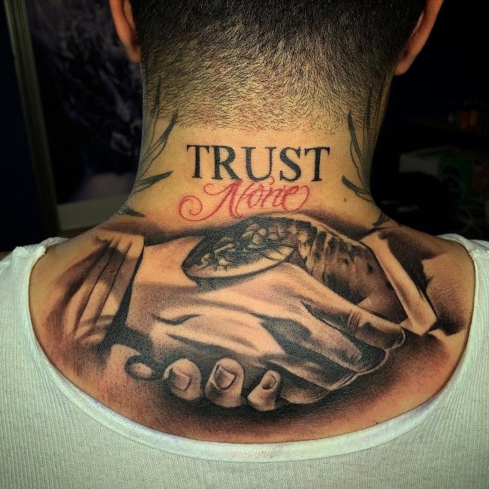 Astonishing designs of Trust no one tattoo on hand