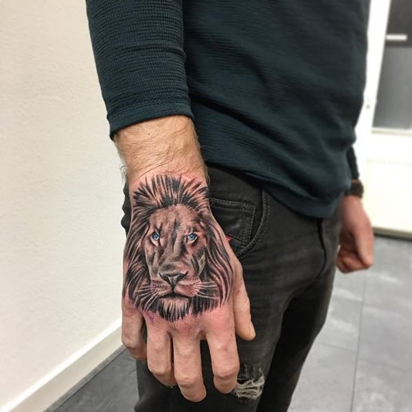 Zealand Tattoo - Gorgeous Black & Grey lion hand piece for... | Facebook