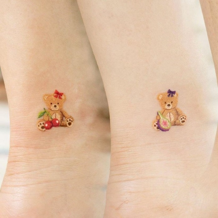 Teddy bear and cupcake tattoos done on the arm