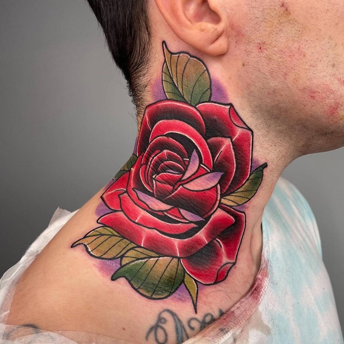 Blue rose tattoo on the right side of the neck