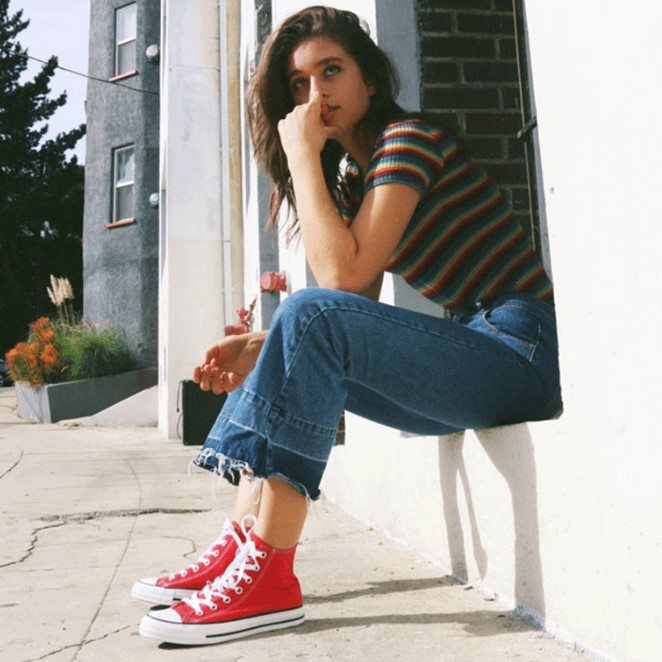 wearing white high top converse